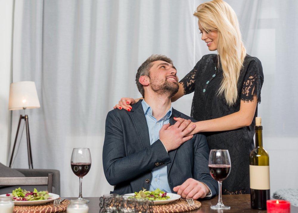 Smartly dressed couple sharing a relaxed moment at home
