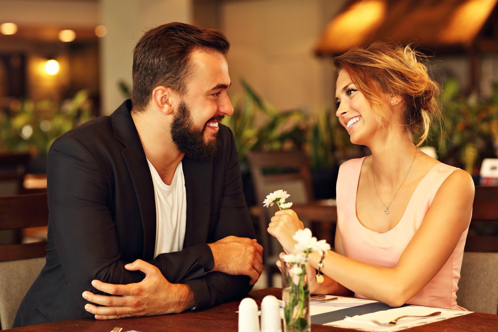 Professional couple enjoying a conversation over dinner